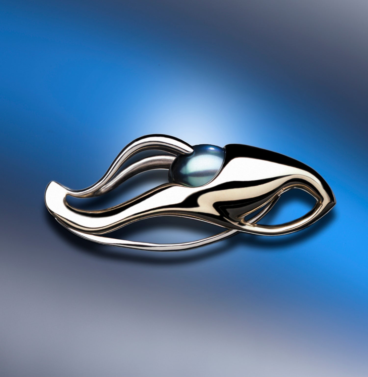Silver ring with a blue gemstone on a beige background