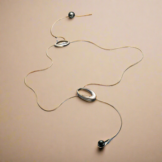 Ikrek közt nyakék 14k, sárga és fehér arany, gyémánt, tahiti gyöngy